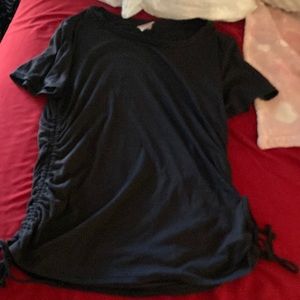 black shirt with ribbons atbthe bottom that can be undone!